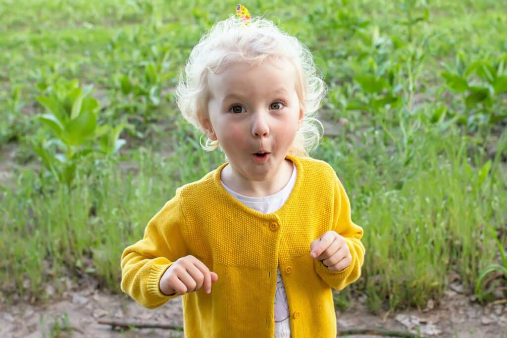 Wow. Surprise astonished girl. Toddler portrait looking surprised in full disbelief wide raising